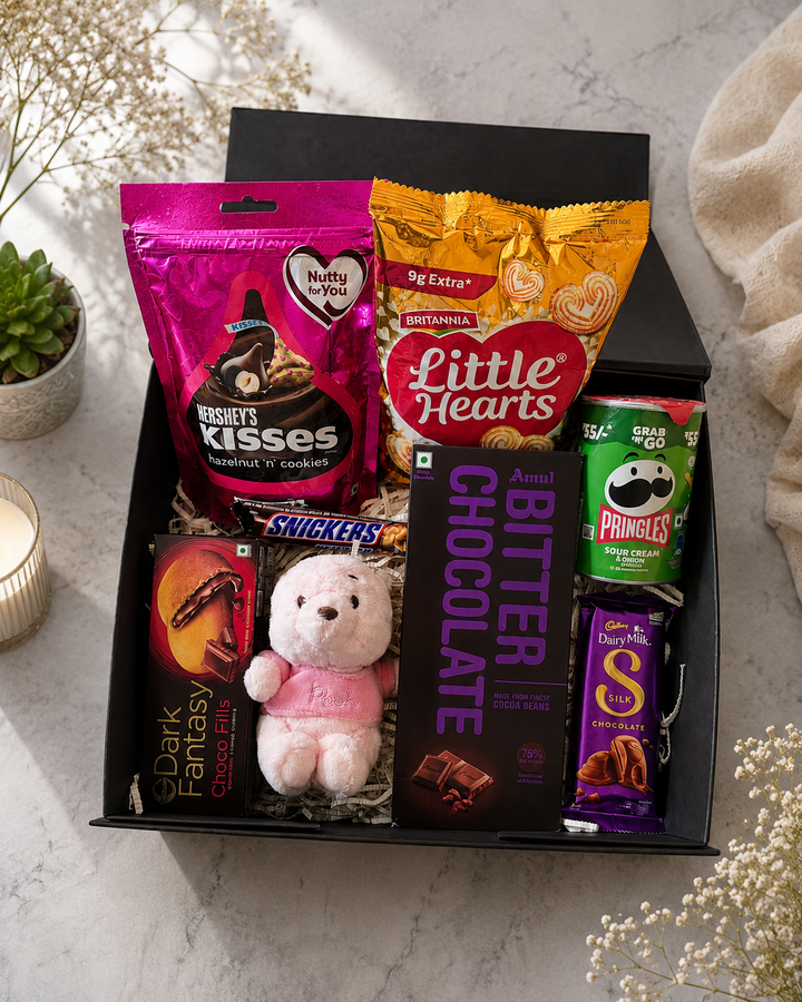 Luxury personalized chocolate gift hamper in a premium black magnetic gift box featuring Hershey's Kisses, Little Hearts cookies, Pringles, Amul dark chocolate, Cadbury Dairy Milk Silk, Snickers, Dark Fantasy biscuits, and a soft teddy bear. Perfect for birthdays, anniversaries, Valentine's Day, couples, girlfriends, boyfriends, and special occasion gifting in India