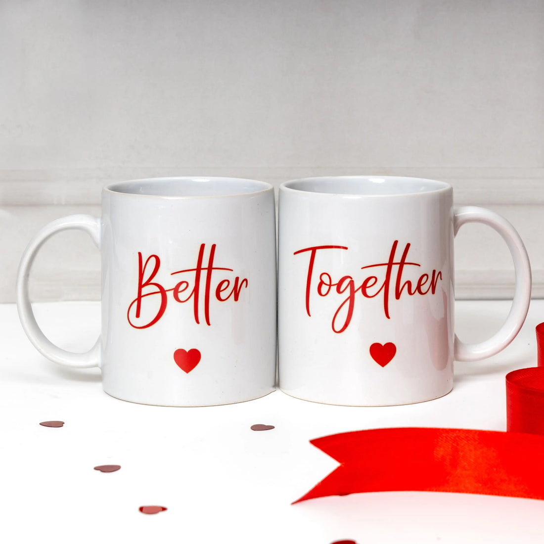 Two white mugs with 'Better Together' text and red hearts on a light gray background, Wedding and anniversary Gifts from Rarejoy