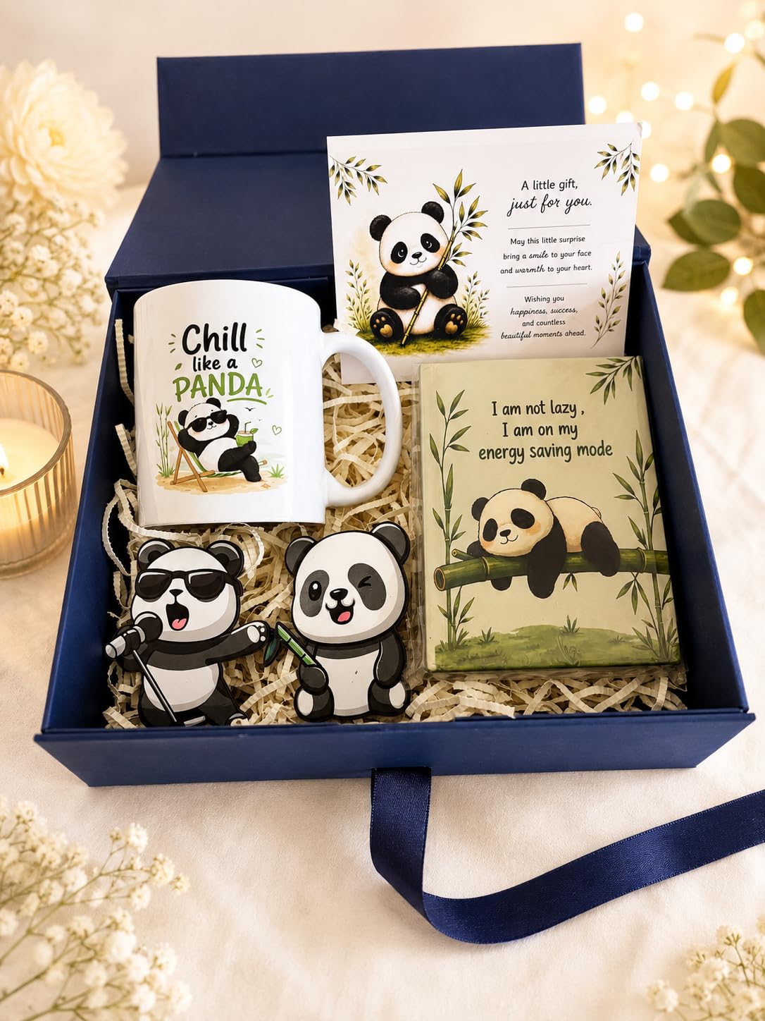 Premium panda-themed gift hamper featuring a ceramic mug, cute panda magnets, inspirational notebook, and heartfelt greeting card in a navy blue box.
