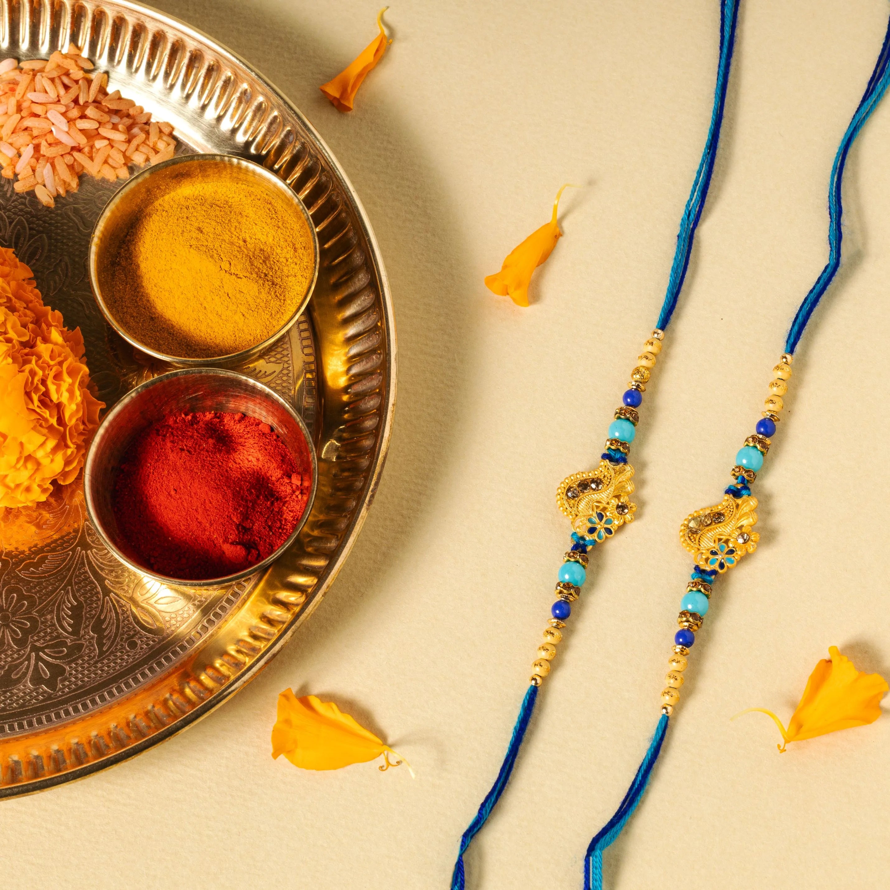 Rarejoy traditional Rakhi with colorful beads and decorative centerpiece, beautifully presented as part of a Raksha Bandhan gift hamper for brother.